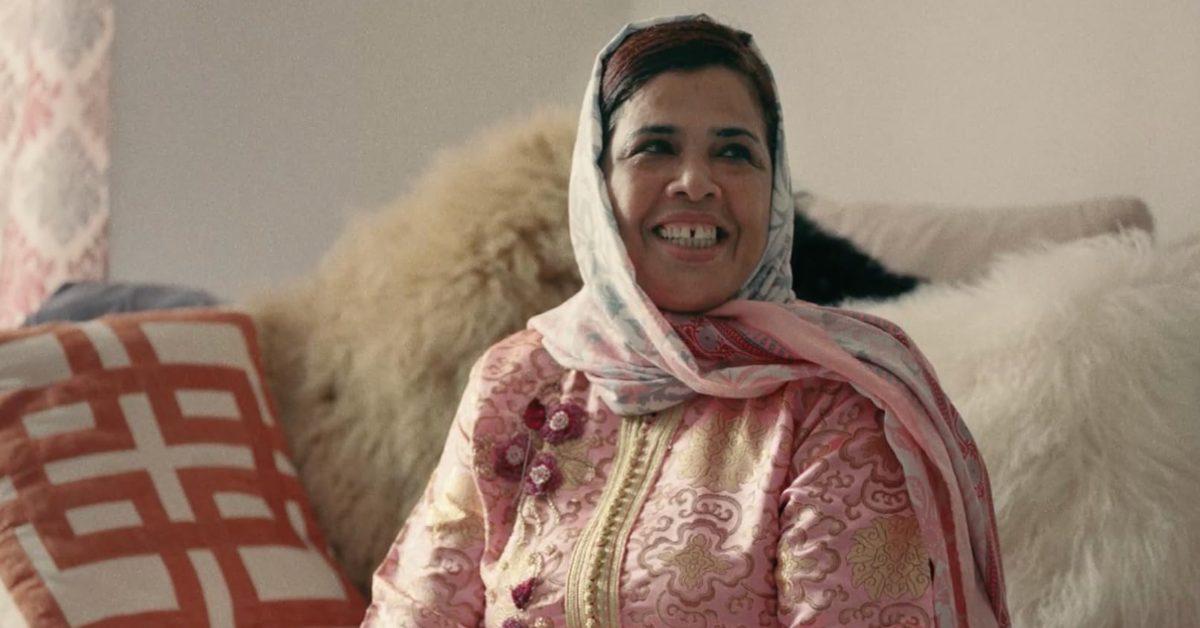 French Montana's mom smiling.