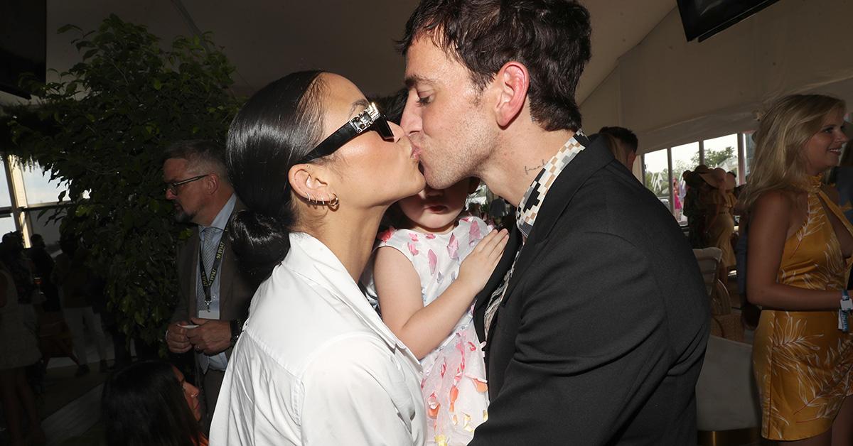 Cassie Ventura and Alex Fine kissing. 