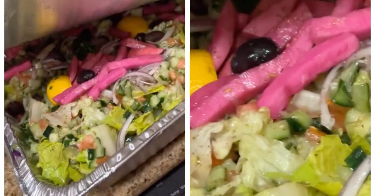 A woman received a catering size salad from DoorDash