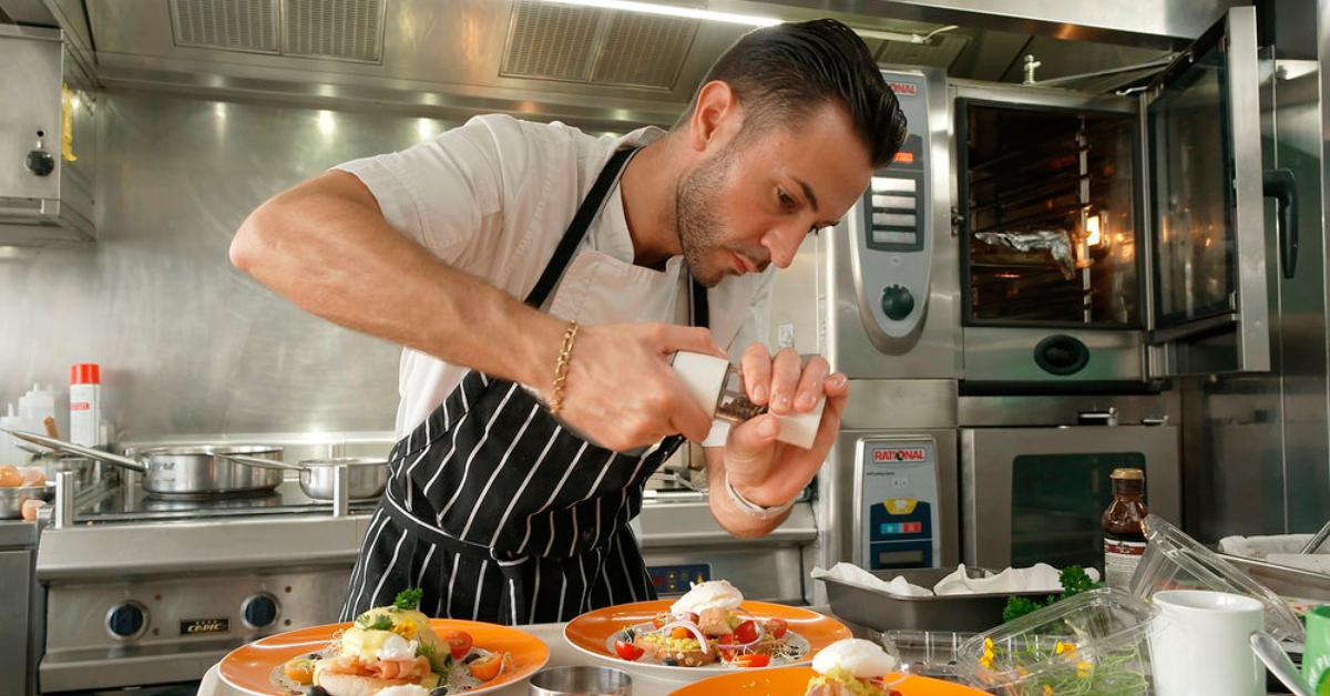 Chef Anthony Iracane adding pepper to a dish in Season 11 of 'Below Deck.'