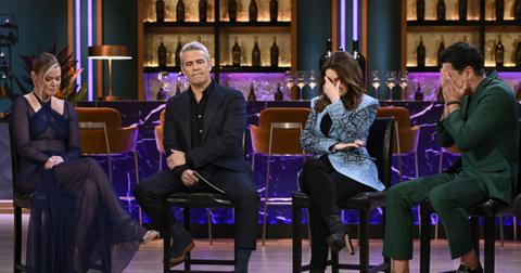 Ariana Madix and Andy Cohen seated during the 'VPR' reunion, while to the right of them both Lisa Vanderpump and Tom Sandoval have their faces in their hands.