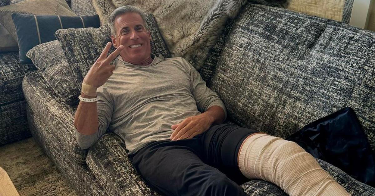 Guy Gansert with a cast on his leg