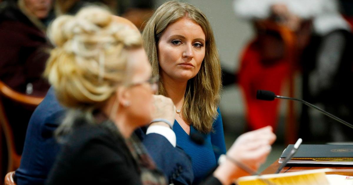 Jenna Ellis (R) listens to Melissa Carone, who was working for Dominion Voting Services, as she speaks in front of the Michigan House Oversight Committee in Lansing, Michigan on Dec. 2, 2020