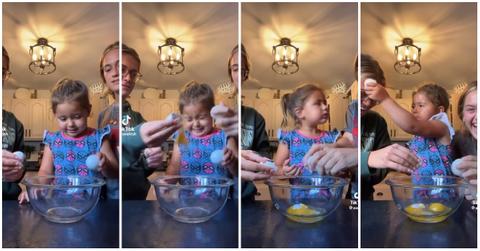 (l-r): Two adults involving a child in a cracked egg on head challenge