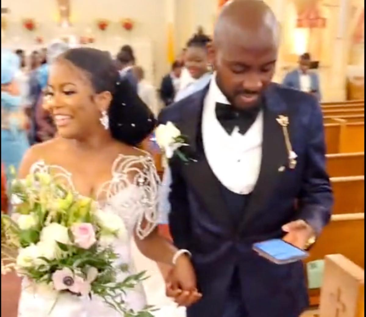 A man on phone wedding aisle