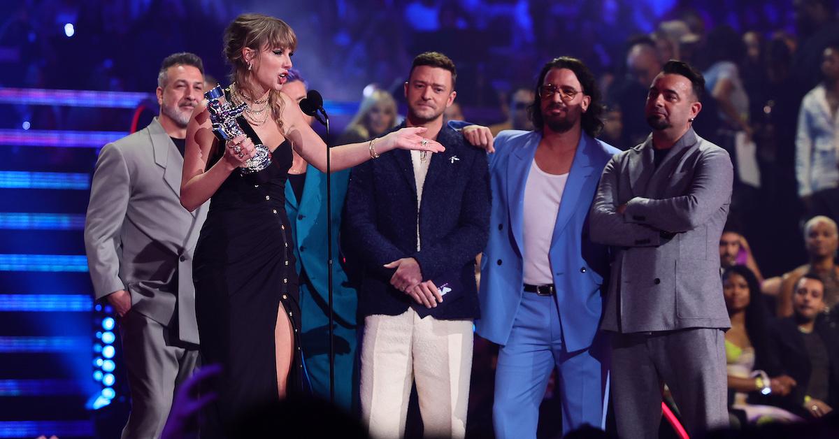 Taylor Swift accepts the Best Pop award for "Anti-Hero" from NSYNC members at the VMAs on Sept. 12, 2023