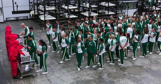 The players of 'Squid Game: The Challenge' lining up for food