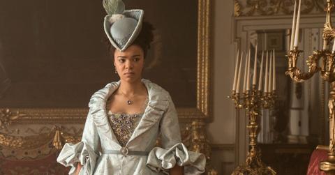 Young Queen Charlotte (India Amarteifio) in a blue gown during a scene in 'Queen Charlotte: A Bridgerton Story'