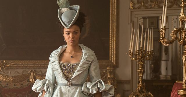 Young Queen Charlotte (India Amarteifio) in a blue gown during a scene in 'Queen Charlotte: A Bridgerton Story'