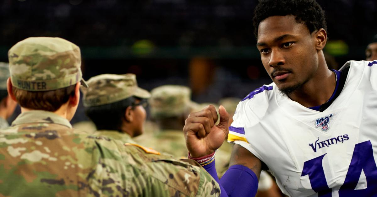 Stefon Diggs fist bumping military service members when he played for the Vikings