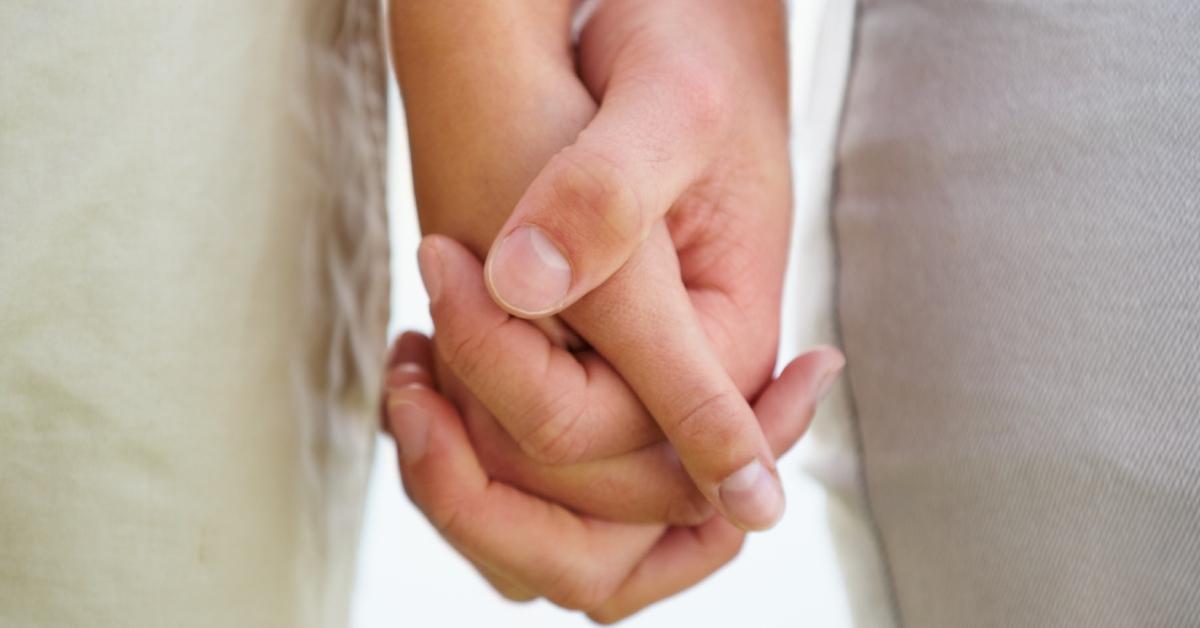 two people holding hands