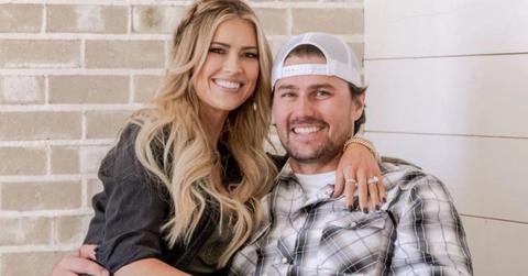 Christina Haack sits on Josh Hall's lap