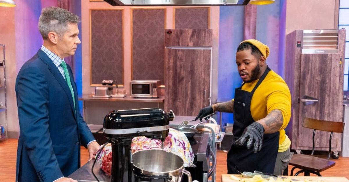 (l-r): John Henson and a contestant filming 'Halloween Baking Championship' Season 8. 