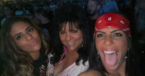 Kathy Crispino and her daughters at a concert
