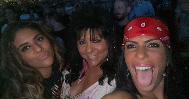 Kathy Crispino and her daughters at a concert