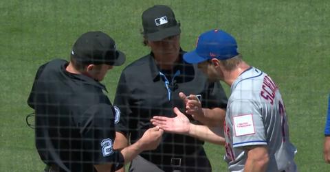 Mets pitcher Max Scherzer argues with umpires during the Mets-Dodgers game on April 19, 2023.