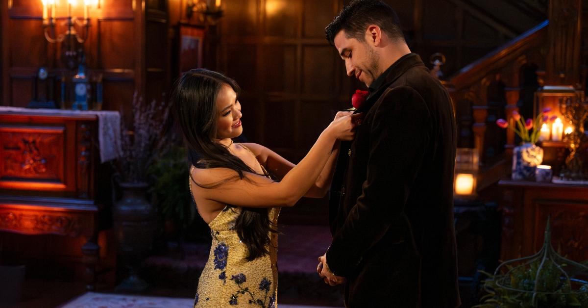 Jenn pins a rose on Devin's jacket on The Bachelorette