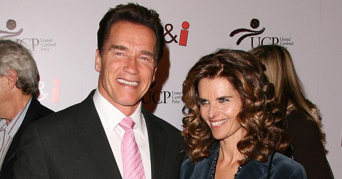 Arnold Schwarzenegger and Maria Shriver pose and smile at the premiere of 'The Kid and I'.