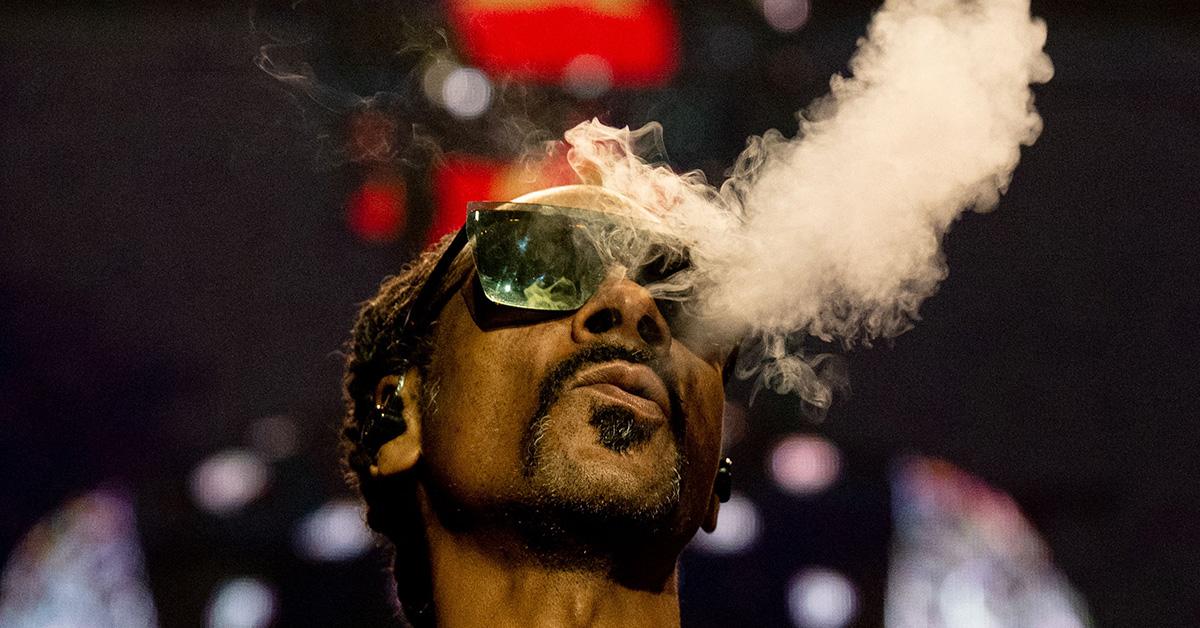 Snoop Dogg puffing smoke in Paris in 2023. 