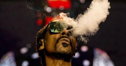 Snoop Dogg puffing smoke in Paris in 2023.