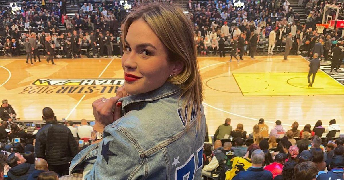 Anamaria Goltes at a Dallas Mavericks game in February 2023, wearing a denim jacket with his name on it