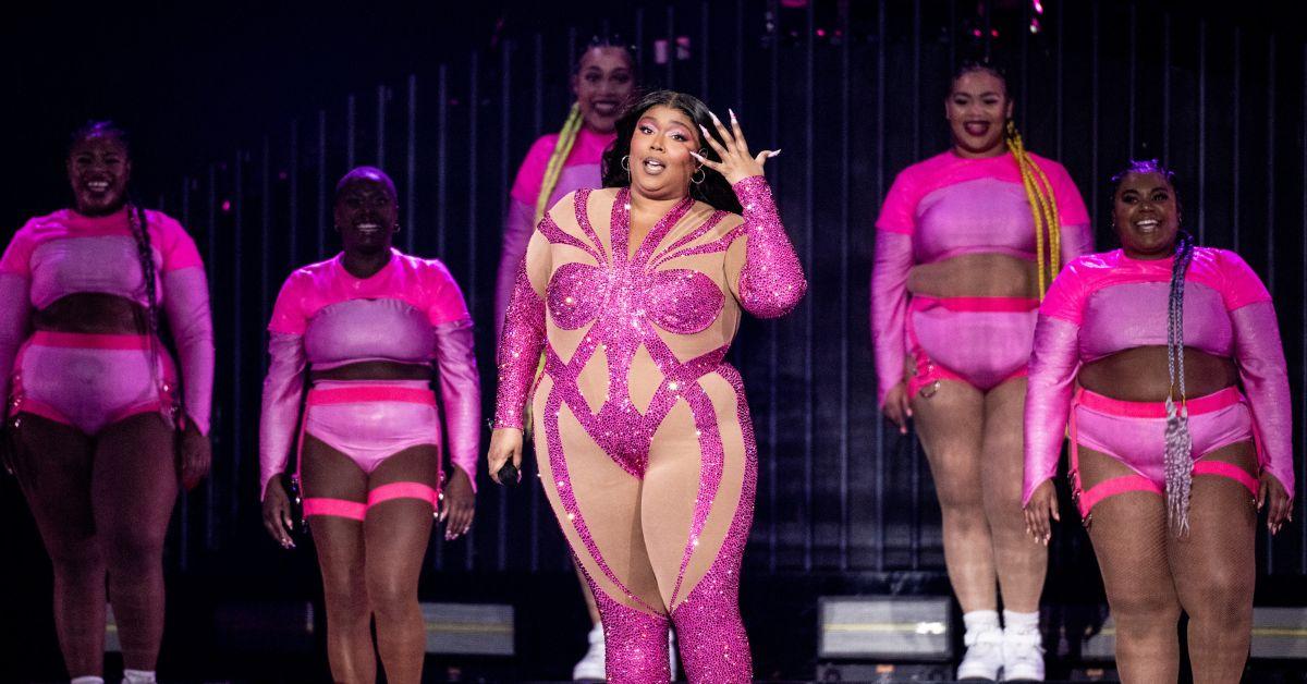 https://media.distractify.com/brand-img/FXMdT6SOl/0x0/lizzo-background-dancers-pink-outfits-1691598764379.jpg