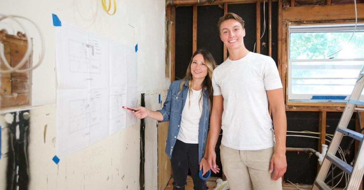 Kristin Leitheuser and Davina Thomasula pose next to building plans.