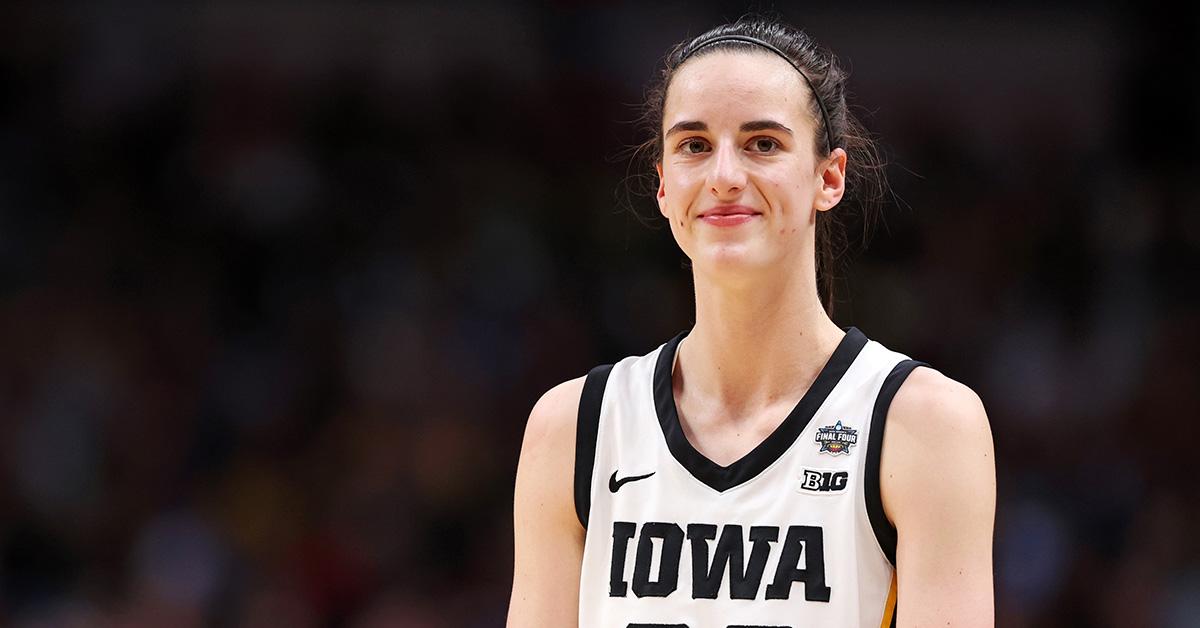 Caitlin Clark smiling during a game against LSU. 