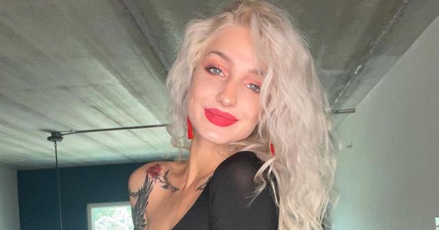 Moriah Plath smiling in a black dress