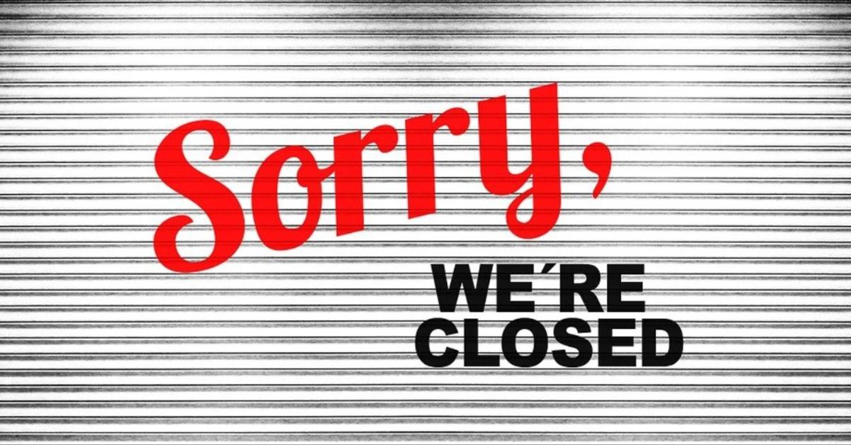 A restaurant displays a closed sign. 