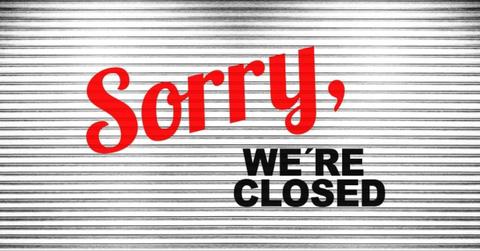 A restaurant displays a closed sign.