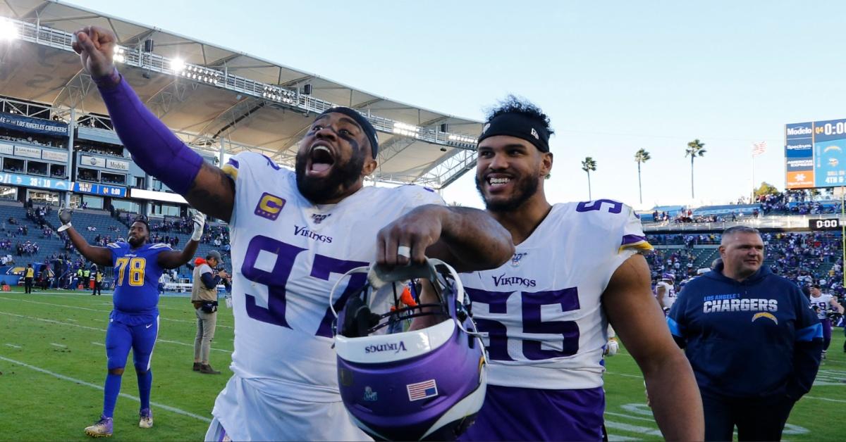 Everson Griffen and Anthony Barr celebrate after the Minnesota Vikings beat the Los Angeles Chargers at a game in 2019.