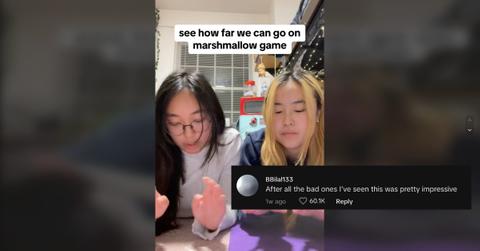 Two girls playing the marshmallow game