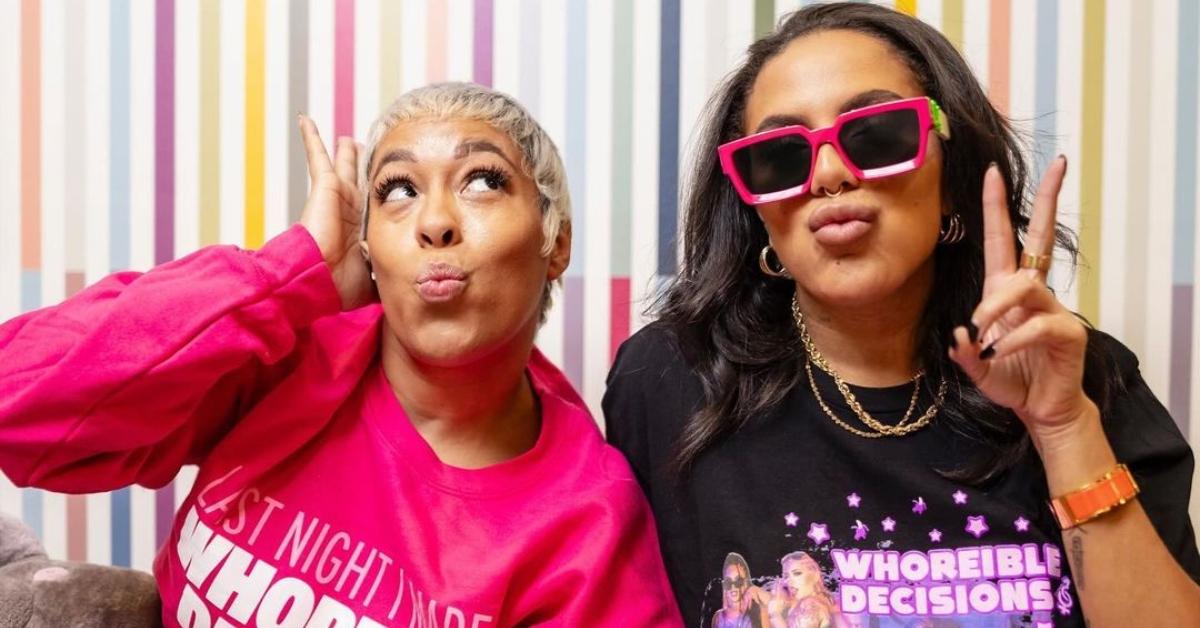 (l-r): Mandii B and Weezy posing in 'Whoreible Decisions' merch