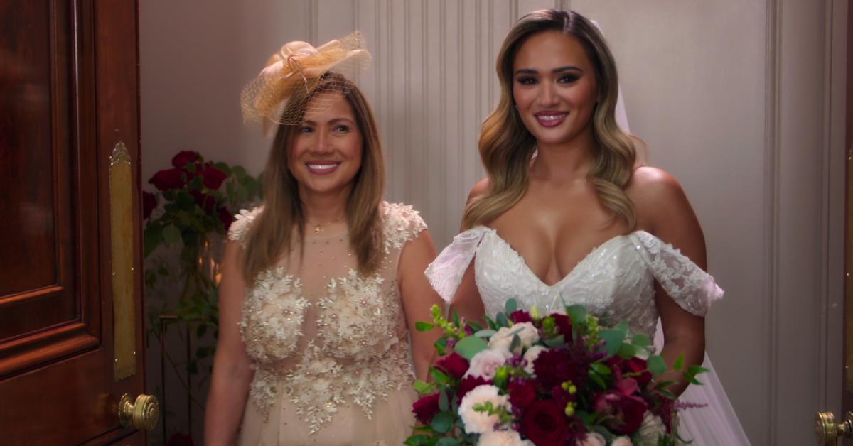 Jasmine smiling on her wedding day alongside her mom, Marisa.