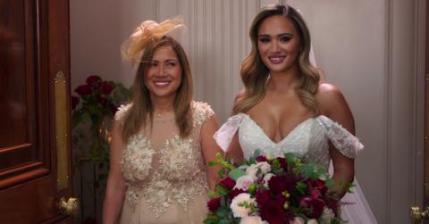 Jasmine smiling on her wedding day alongside her mom, Marisa.