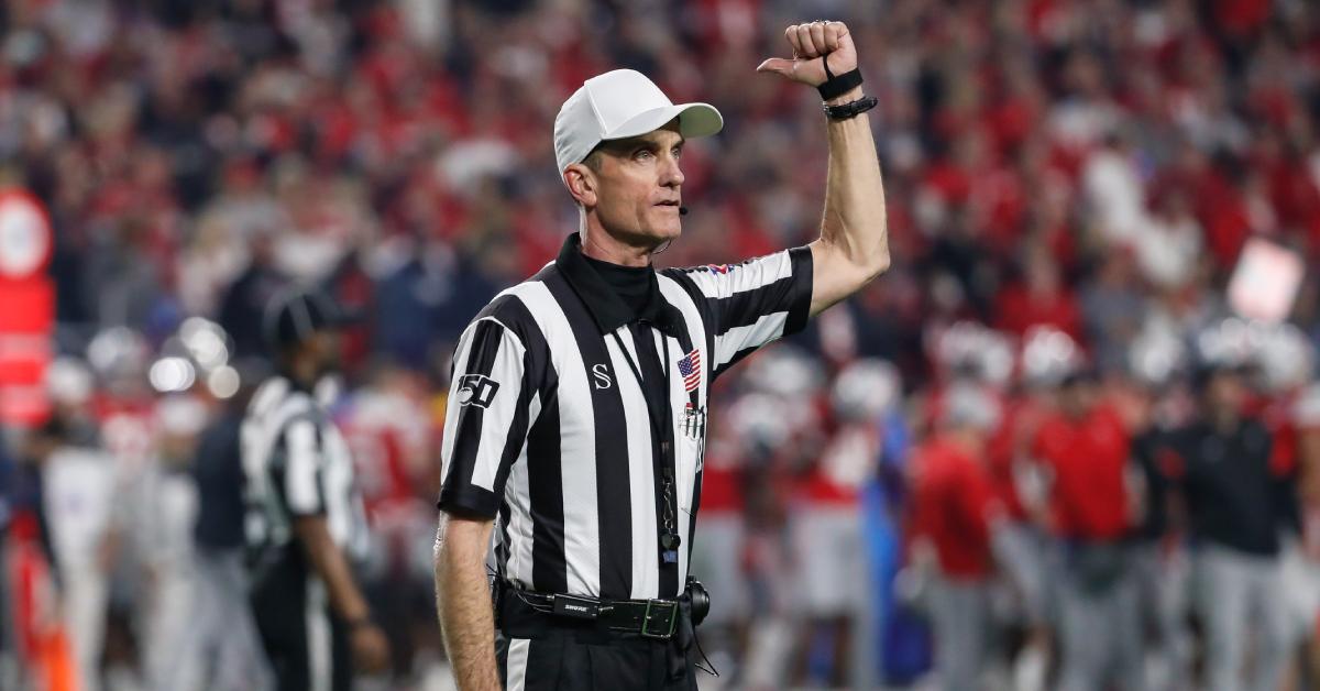 A referee signals an ejection in 2019