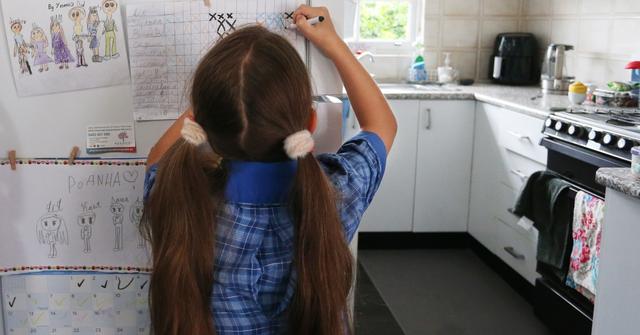 A child completes chores