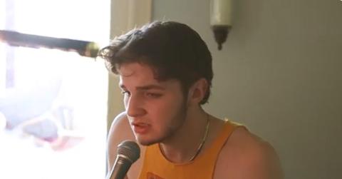 Rivers McMillen singing into a microphone