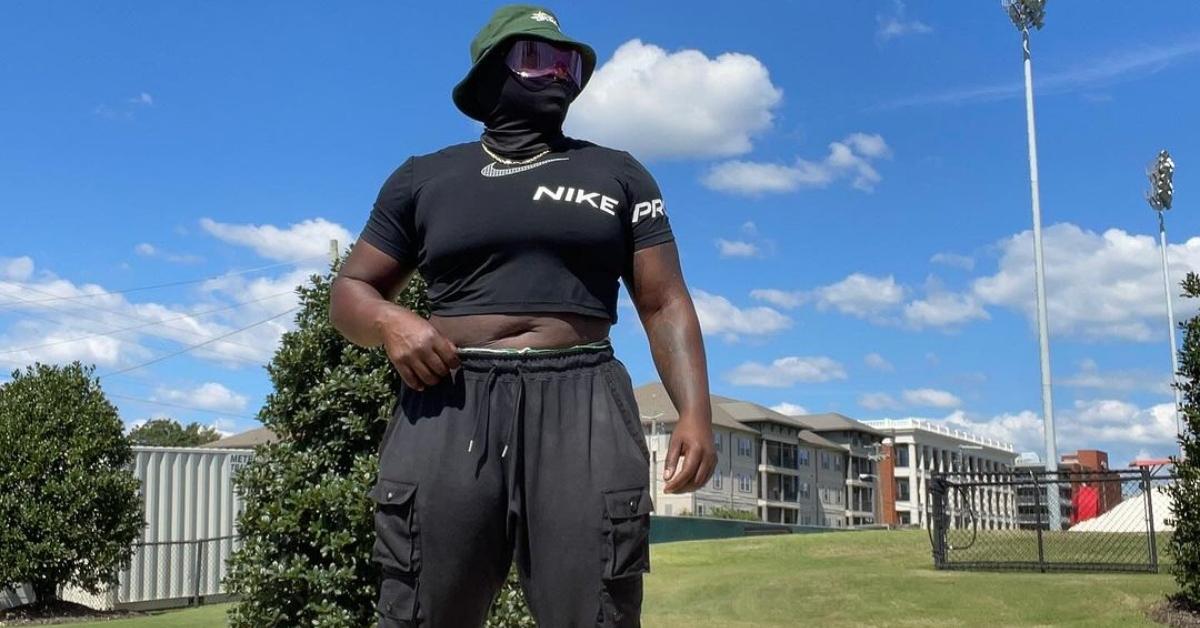 Raven Saunders in a mask that covers their face