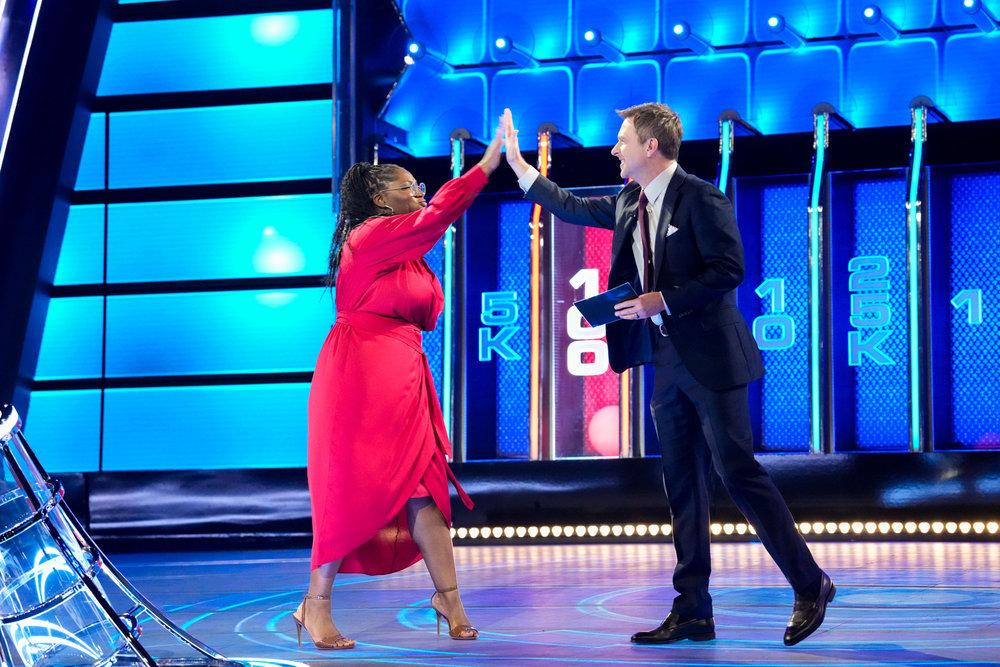 Bria high fives host, Chris Hardwick, on 'The Wall'