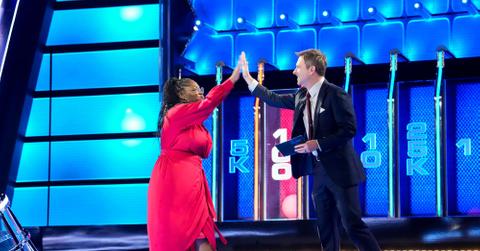 Bria high fives host, Chris Hardwick, on 'The Wall'