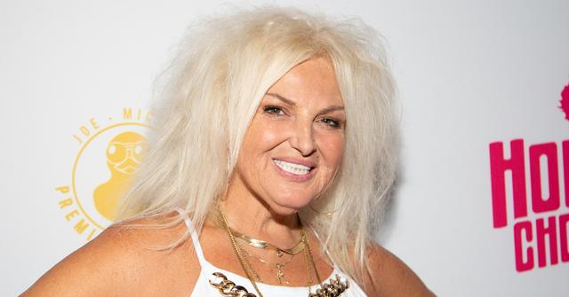 Angela Deem, with extremely teased hair, poses on the red carpet at Reality Lip Sync Battle at Slate NYC on Aug. 1, 2023.