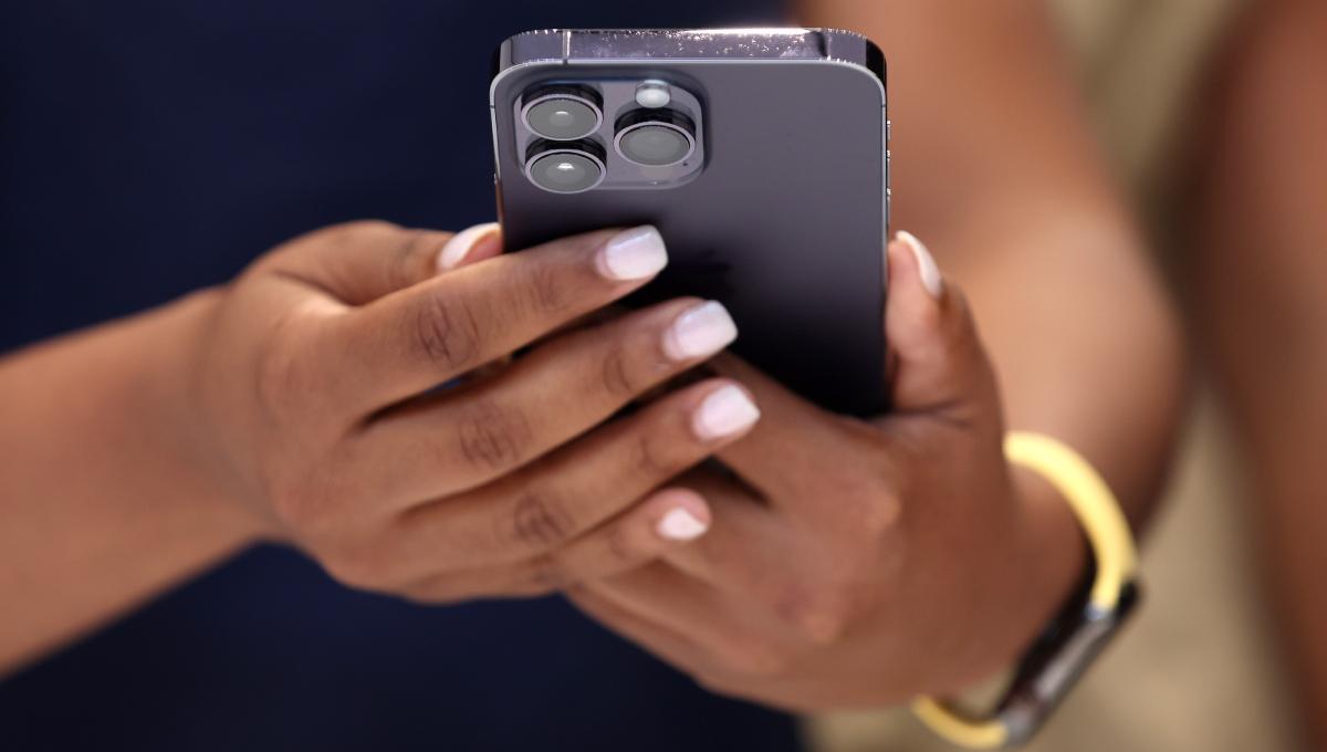 woman holding an iphone in her hands