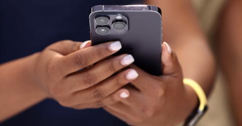 woman holding an iphone in her hands