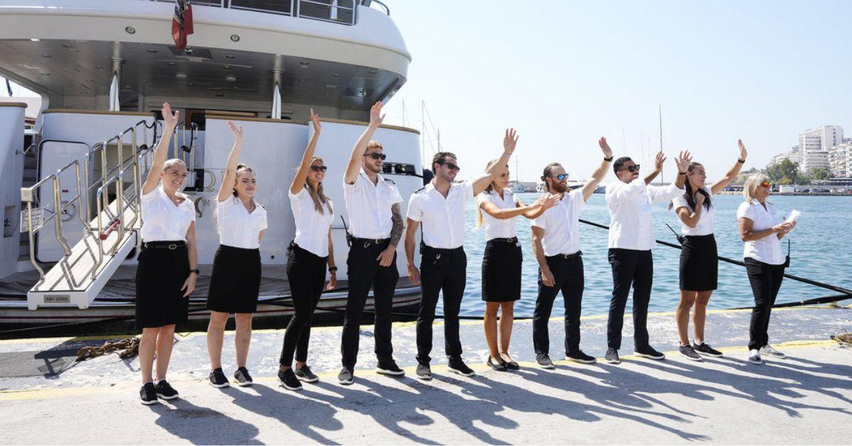 The Mustique Crew waves to guests in front of the superyacht on 'Below Deck Med'