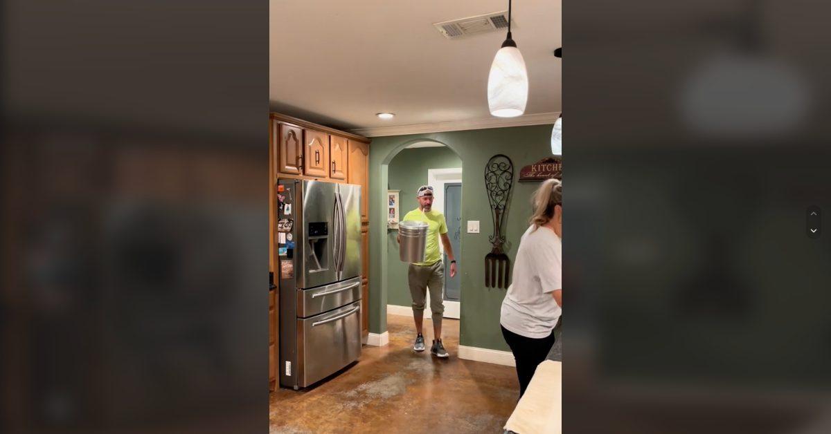 A husband mocks his wife's giant water bottle