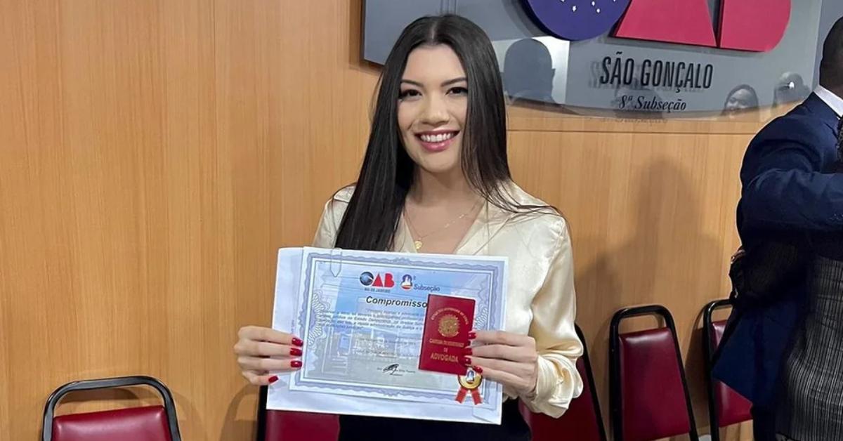 Nathalia Lima of 'Seeking Sister Wife' smiles and proudly displays her certificate as a lawyer in Brazil.