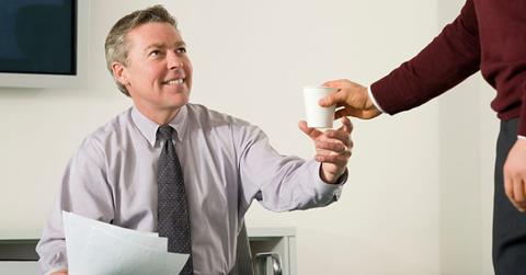 A stock photo of someone being offered a drink.