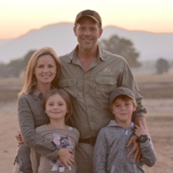 Lynsey Cumings, Lauren Cumings, Grant Cumings and Scott Cumings pose for a photo in the wild.